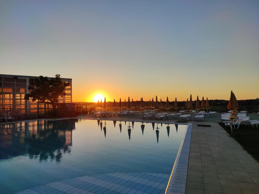 Poolside photo in the evening with sunset