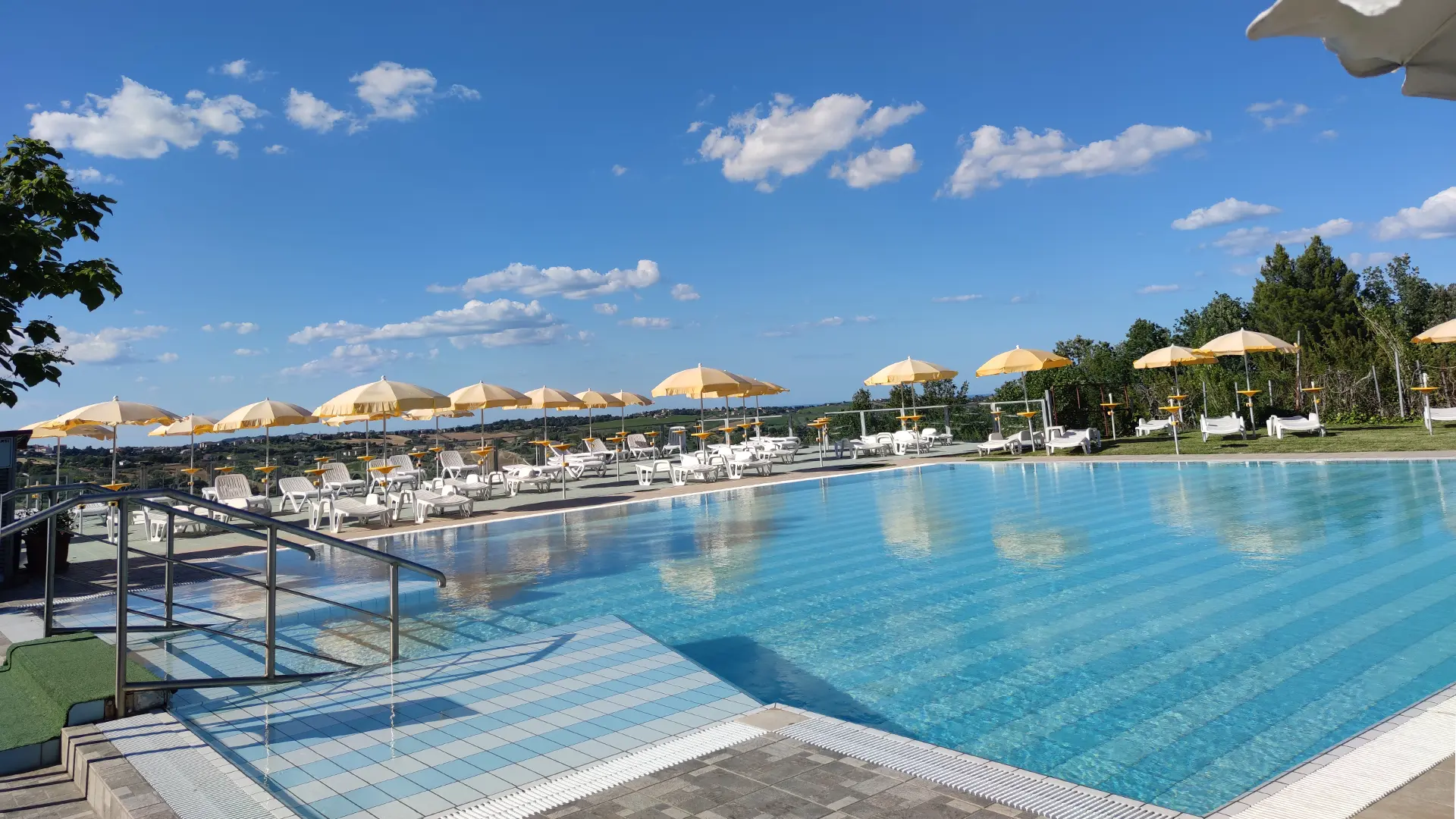 Photo of the umbrellas on the terrace by the large outdoor pool